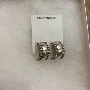 Sterling silver handmade Navajo clip back hoop earrings.